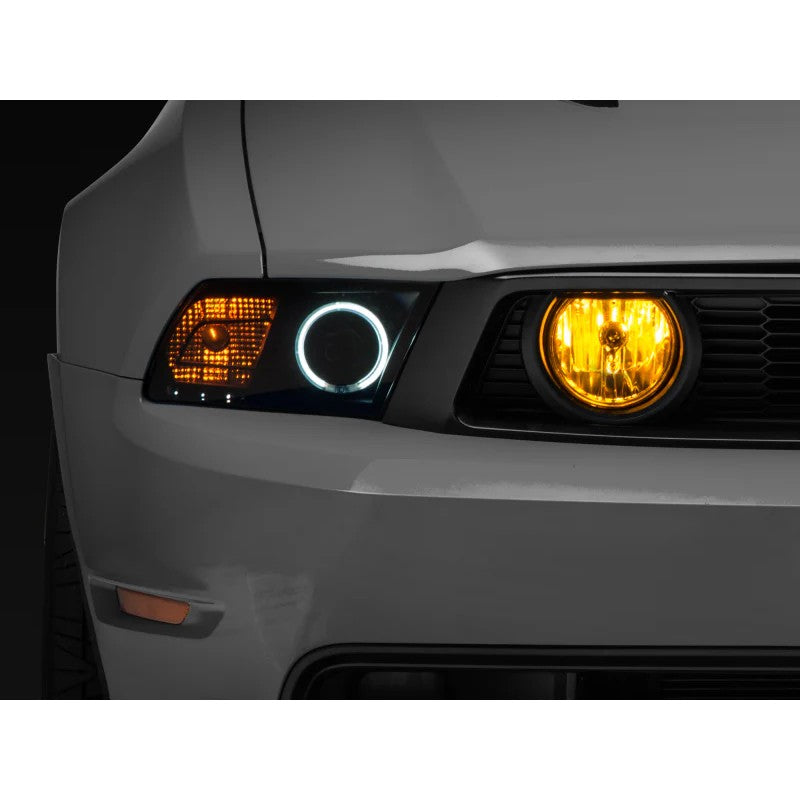 Pair of Raxiom fog lights with yellow tinted lenses for 2005-2012 Ford Mustang GT.