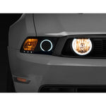 Chrome Raxiom fog lights with integrated white LED halo rings and clear lenses for 2005-2012 Ford Mustang GT.