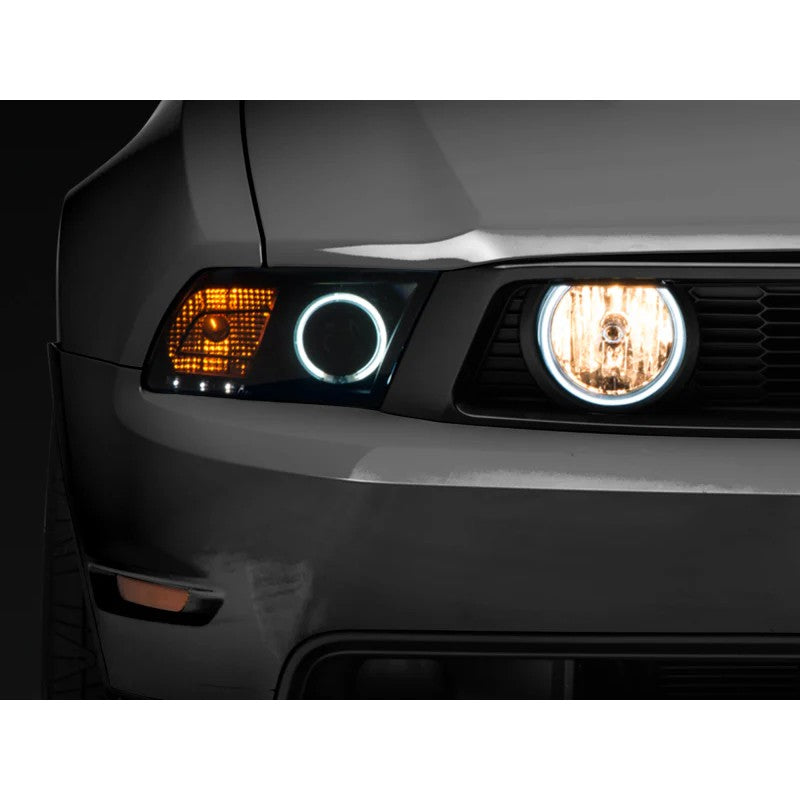 Pair of Raxiom smoked fog light housings with integrated CCFL halos for 2005-2012 Ford Mustang GT.