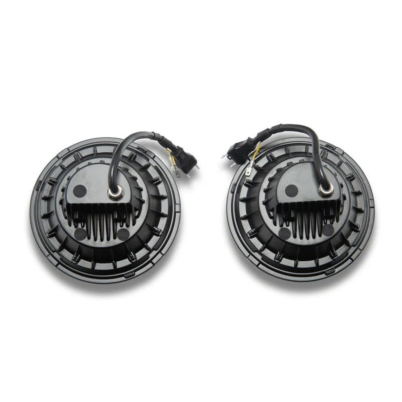 Raxiom Hi-Output LED headlights for Jeep Wrangler JK with black internal housing, clear lens, and halo DRL rings.