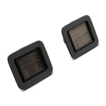 Pair of Raxiom Axial Series LED license plate lamps with smoked lenses and black housings for 2015-2024 Ford F-150.