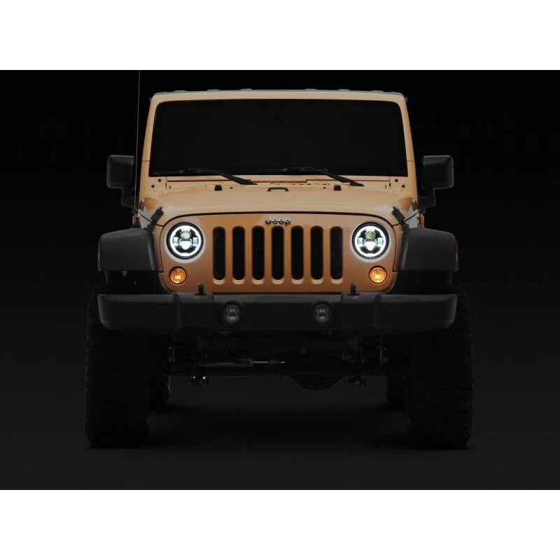 Raxiom Axial Series 7-inch round black LED headlights with clear lenses and integrated DRL for Jeep Wrangler JK.