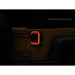 Raxiom Axial Series LED halo tail lights with black housings and dark smoked lenses for 2007-2018 Jeep Wrangler JK