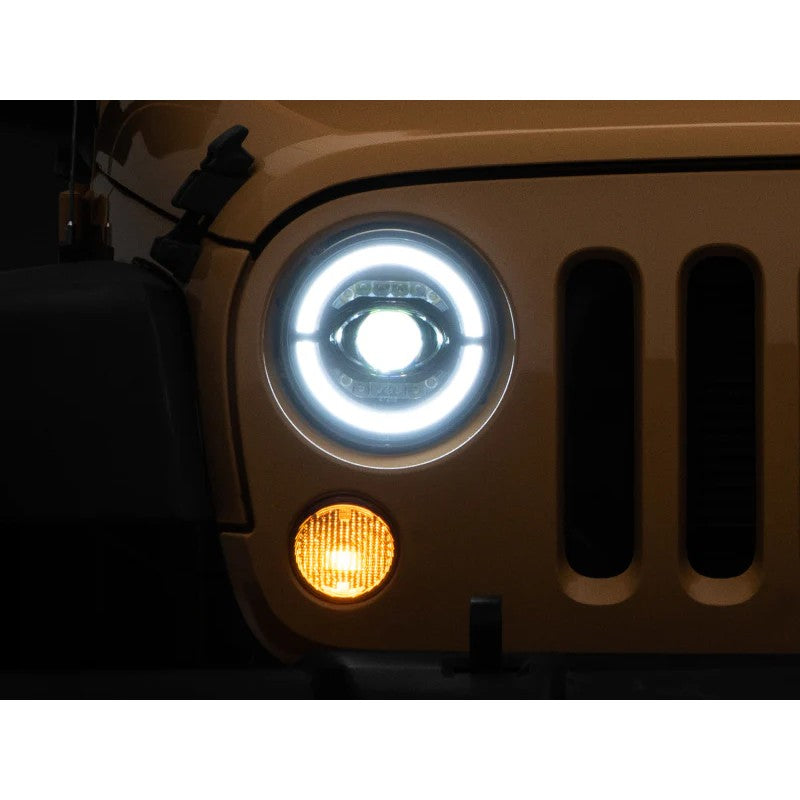 Pair of Raxiom Axial Series LED projector headlights with black housings and integrated halo accents for Jeep Wrangler JK