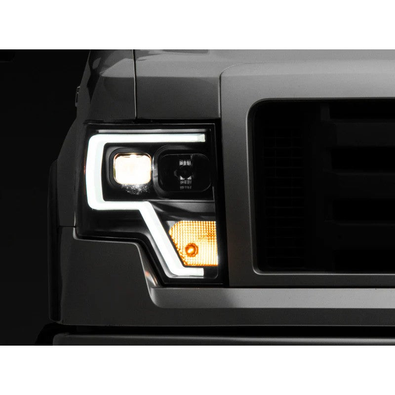 Raxiom projector headlights with black housings, clear lenses, and LED accents for 2009-2014 Ford F-150.