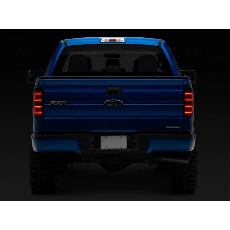 Raxiom Axial Series LED tail lights with black housings and smoked lenses for 2009-2014 Ford F-150 Styleside trucks.