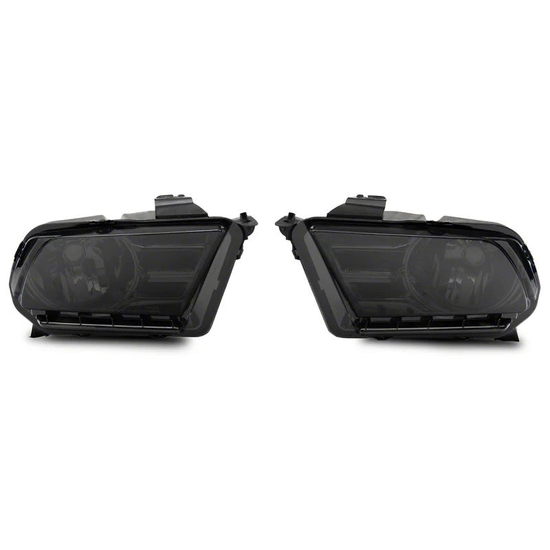 Raxiom Axial Series smoked lens headlights with chrome reflectors and black housings for 2010-2012 Ford Mustang.