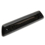 Smoked Raxiom Axial Series LED third brake light with black housing and integrated cargo light for 2010-2014 F-150 Raptor.