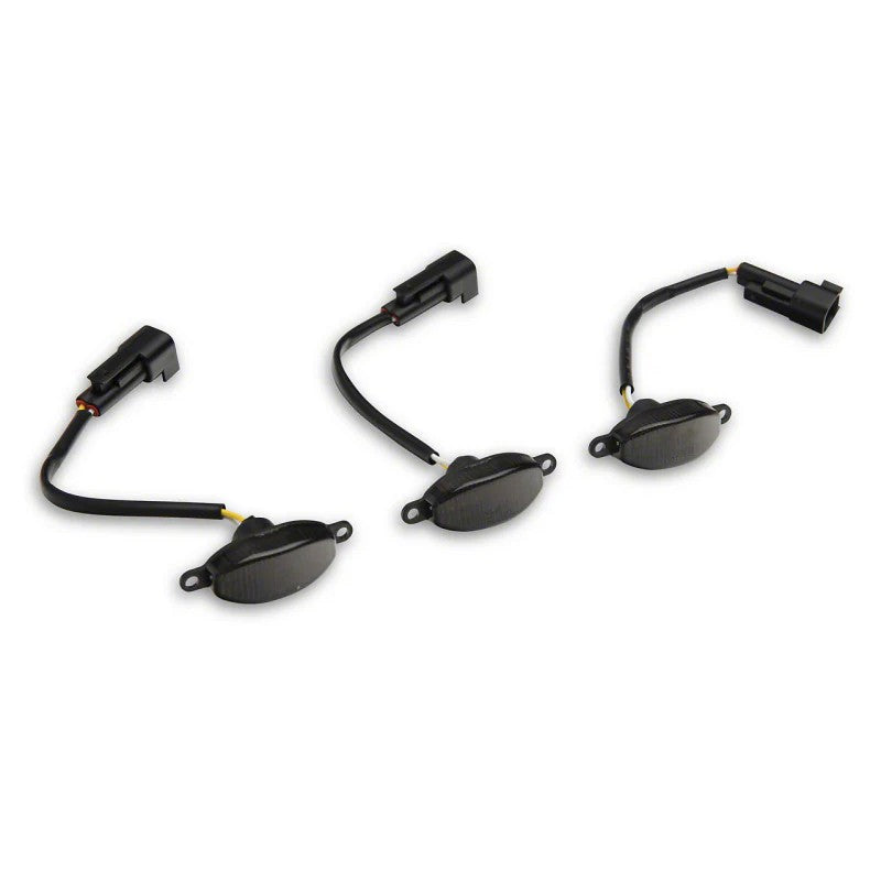 Set of three Raxiom Axial Series LED grille lights with smoked lenses and black housings for Ford F-150 Raptor.