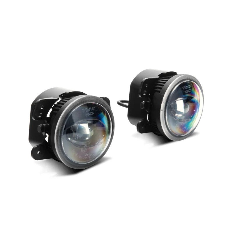 Pair of Raxiom Axial Series 4-inch round LED fog lights with clear polycarbonate lenses for 2010-2025 Jeep Wrangler.