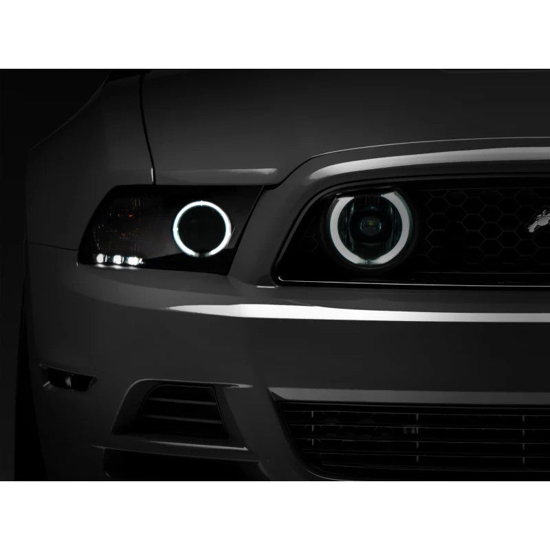 Pair of Raxiom smoked lens fog light housings with integrated white CCFL halo rings for 2013-2014 Mustang GT.