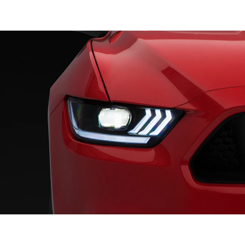 Raxiom black housing projector headlights with clear lenses and white LED accents for 2015-2022 Ford Mustang.