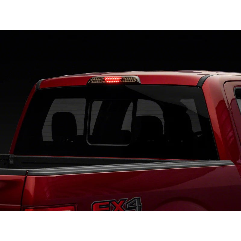 Raxiom Axial Series smoked LED third brake light with black housing and integrated white cargo light LEDs.