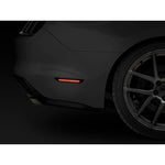 A pair of Raxiom Axial Series smoked rear LED side marker housings with red SMD focal strips for 2015-2023 Ford Mustang.