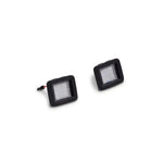 Raxiom Axial Series LED license plate lamp assembly with black housing and clear lens for 2015-2023 Ford F-150.