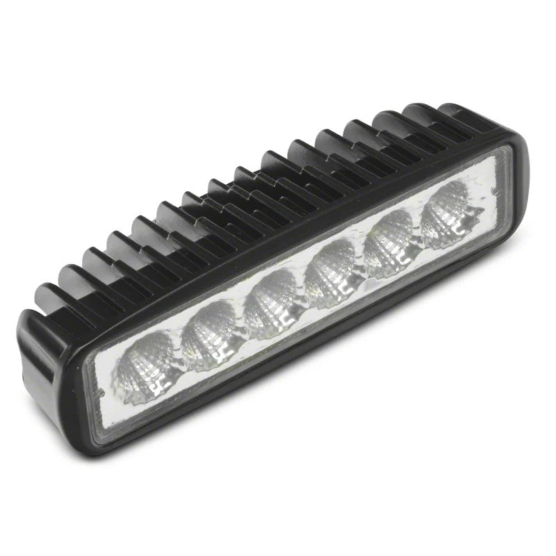 Raxiom slim 6-LED off-road flood light with textured black aluminum housing and clear polycarbonate lens.