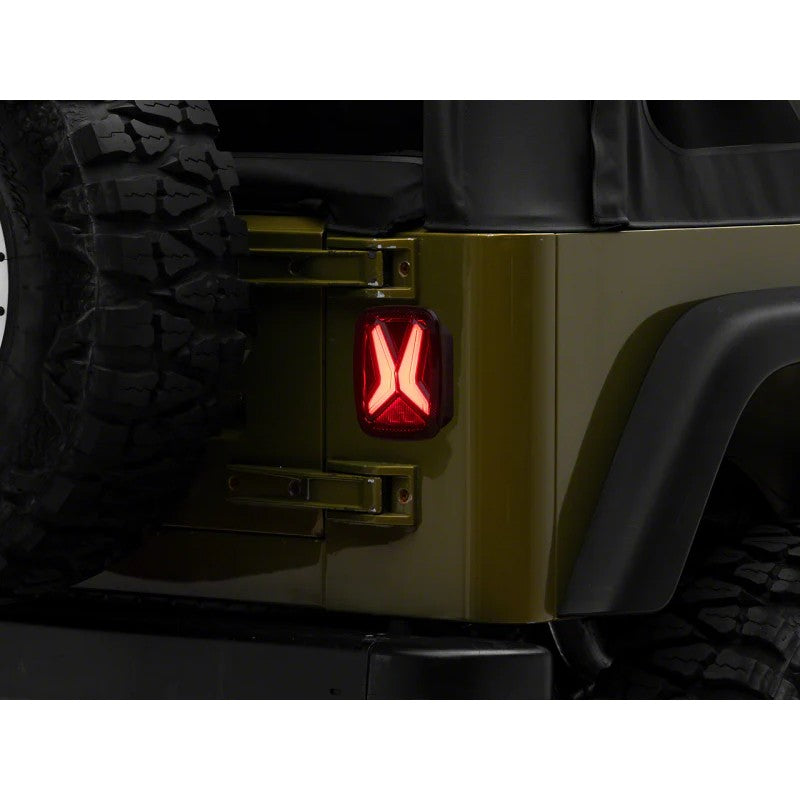 Raxiom Gladiator LED tail light with black housing and smoked lens for Jeep CJ7 and Wrangler.