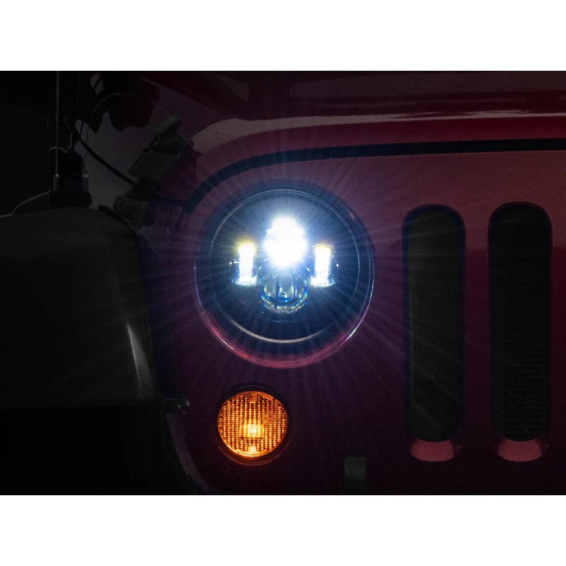 Pair of Raxiom Axial Series 7 inch LED Daymaker headlights featuring black housings and clear lenses.