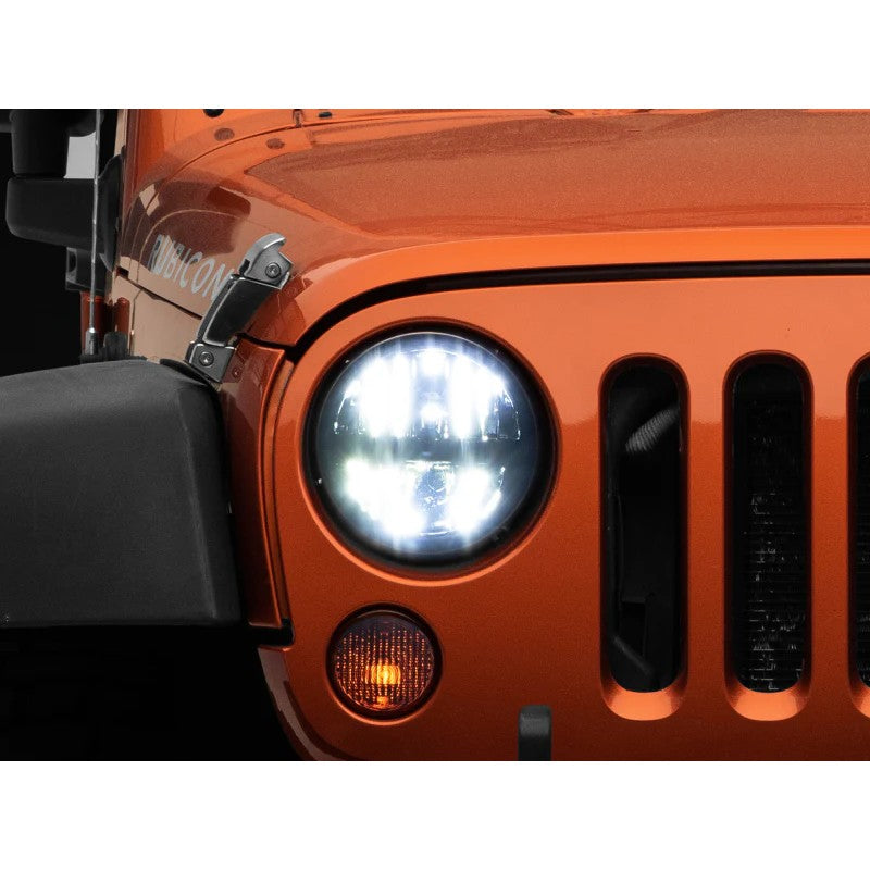 Round 7-inch Raxiom Axial Series LED headlights with black internal housings and clear lenses for Jeep Wrangler.