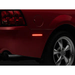 A pair of Raxiom Axial Series smoked LED rear side marker lights for 1999-2004 Ford Mustang models.