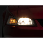 Pair of Raxiom Axial Series headlights for 1999-2004 Mustang with black housings and clear polycarbonate lenses.