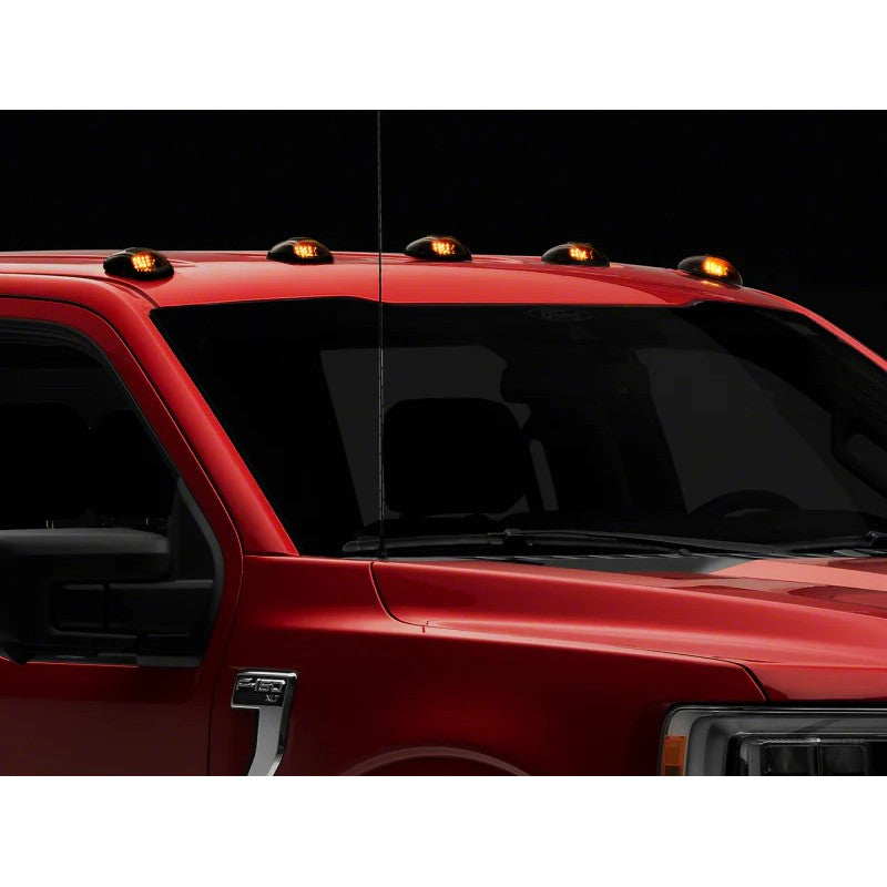 Five Raxiom Axial Series smoked lens LED roof cab marker lights with included wiring switch and connectors.