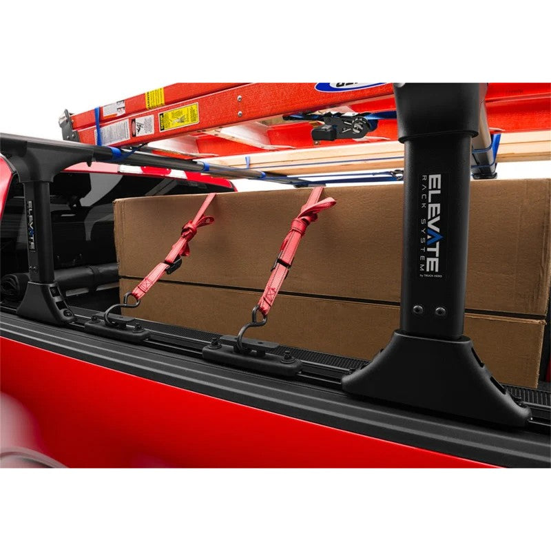 Set of four RealTruck Elevate T-slot tie down anchors with heavy-duty loops and sliding mounting hardware.