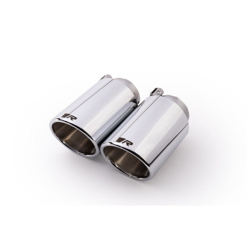 Pair of Remus 102mm angled chrome stainless steel exhaust tips with adjustable mounting clamps.