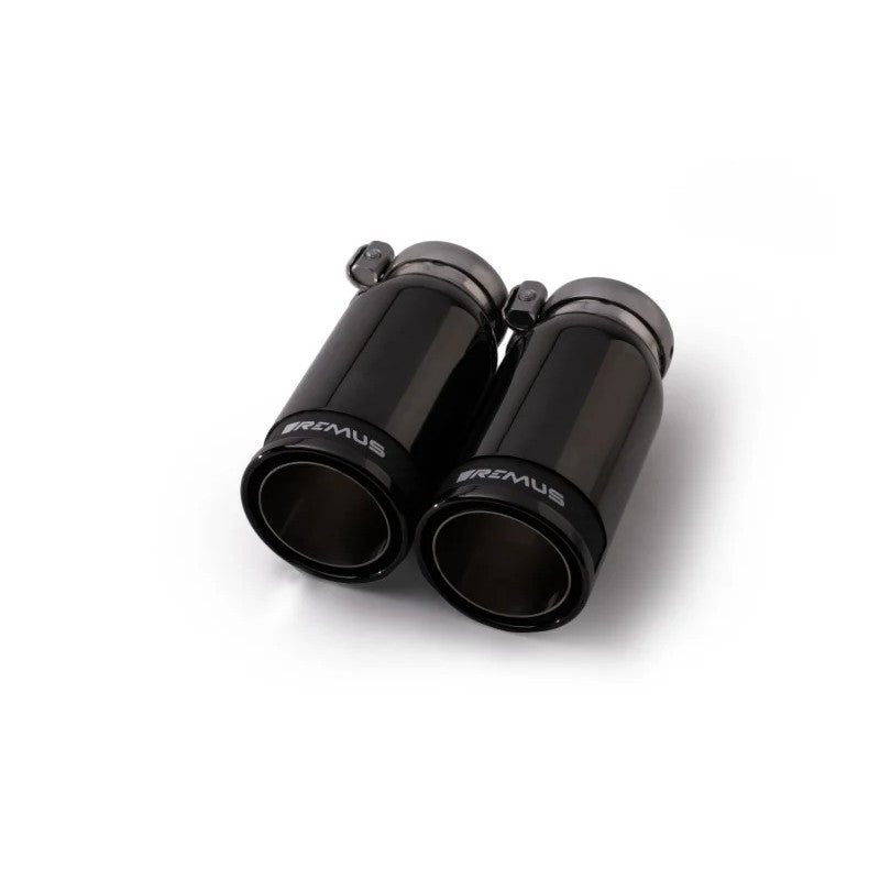 Pair of Remus 84mm stainless steel tail pipes with black chrome finish and carbon fiber inner inserts.