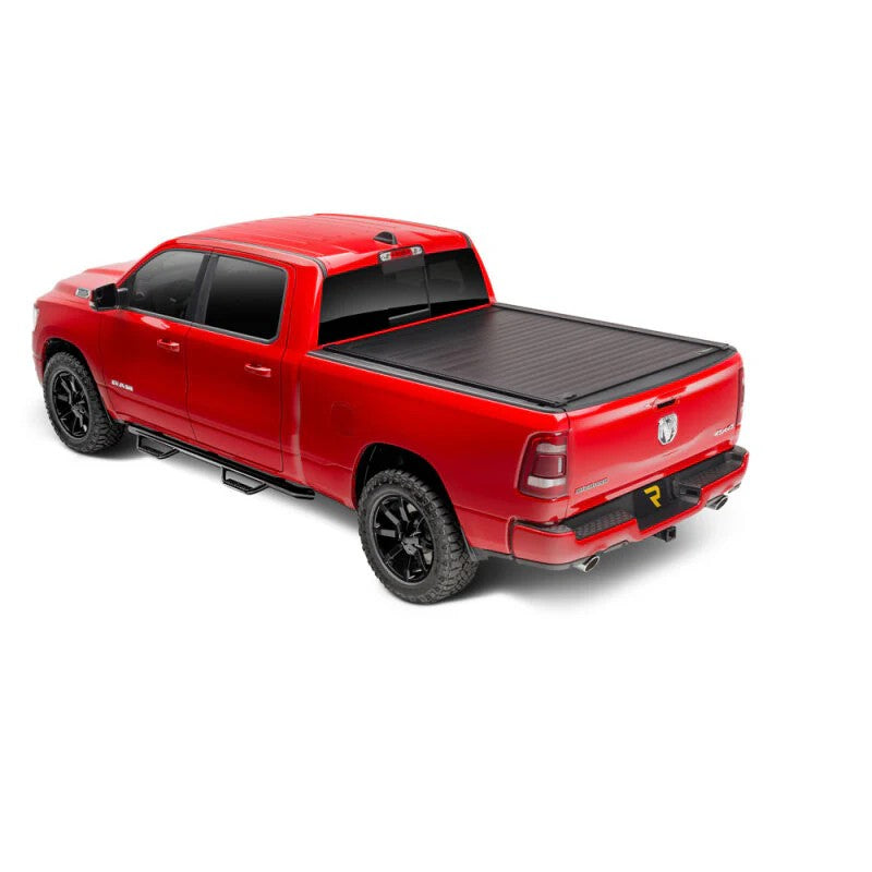 Retrax PowertraxPRO XR electric retractable tonneau cover in matte black finish with integrated T-slot rails.