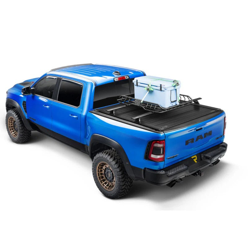 RetraxPRO XR matte black aluminum retractable truck bed cover with integrated T-slot side rails on a pickup truck.