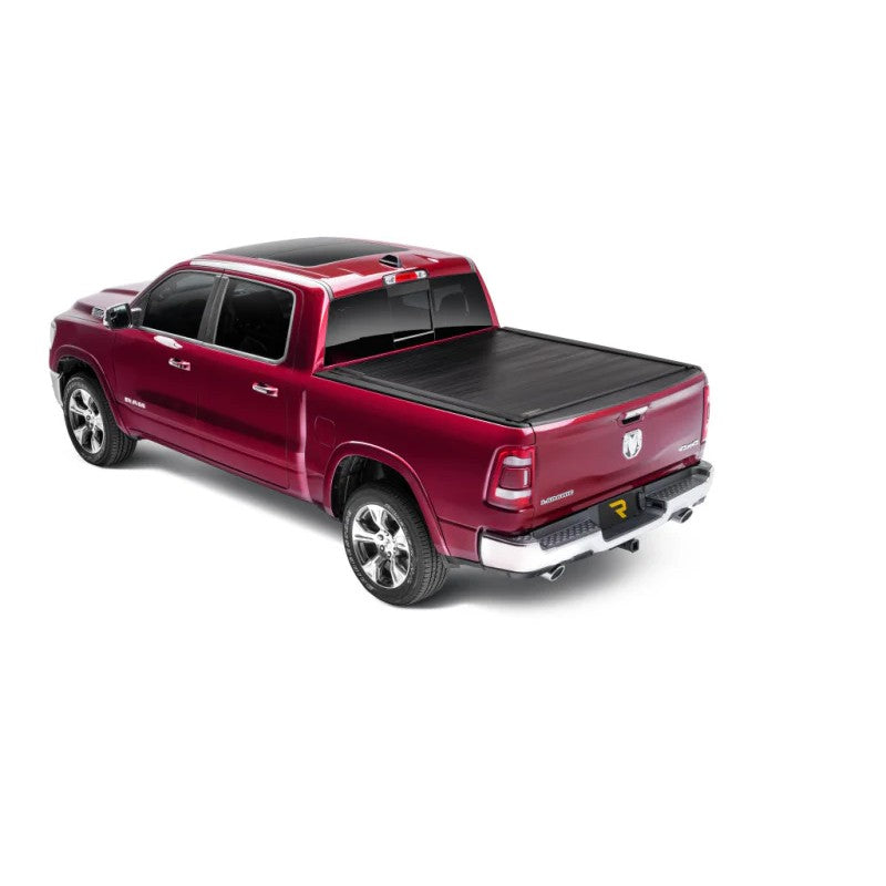 Matte black Retrax IX flush-mounted retractable aluminum tonneau cover on a pickup truck bed.