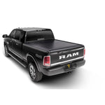 RetraxONE MX manual retractable tonneau cover in textured matte black on a Dodge Ram with a 6.5-foot bed.