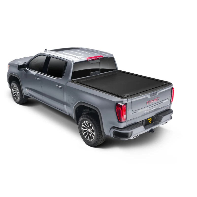 RetraxONE XR retractable truck bed cover with matte black finish and integrated T-slot rails on a pickup truck