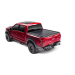 Matte black RetraxONE XR retractable tonneau cover with integrated T-slot rails on a Ram 1500 truck bed.