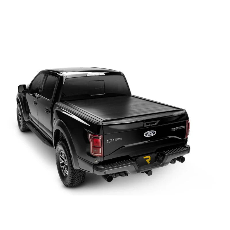Retrax PowertraxPRO MX matte black retractable aluminum truck bed cover installed on a 2020-2026 Chevrolet Silverado HD