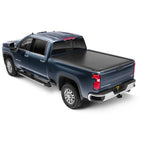 RetraxONE MX matte black retractable tonneau cover installed on a GMC Sierra 2500 HD with a 6 foot 9 inch bed.