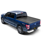 RetraxONE MX manual retractable tonneau cover in textured matte black on a 2021-2025 Ford F-150 with 5.5ft bed