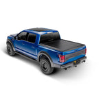 Matte black Retrax IX retractable aluminum tonneau cover on a Ford F-150 with a 5.5ft bed.