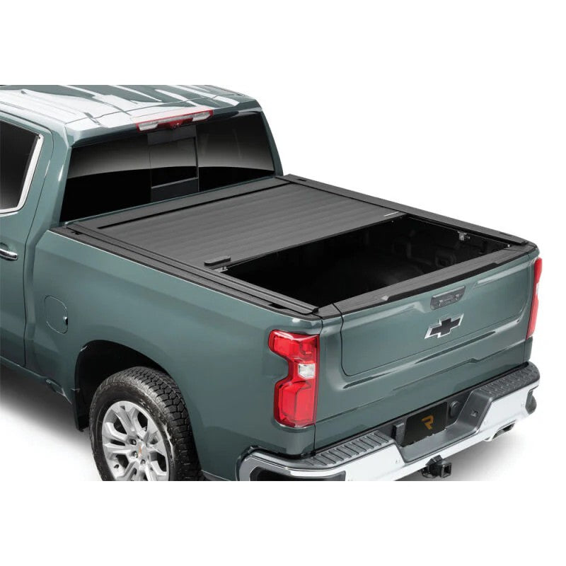 RetraxPRO MX matte black double-wall aluminum retractable tonneau cover on a 2022-2026 GMC Hummer EV Pickup with 5ft bed.