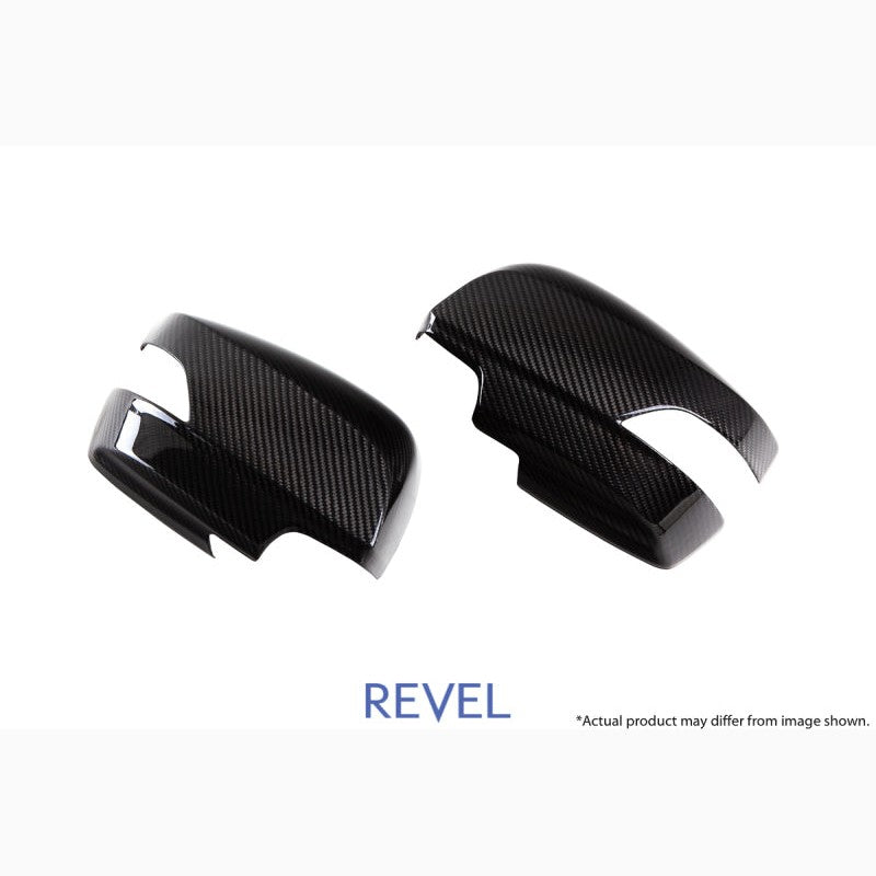 A pair of Revel GT dry carbon fiber mirror covers for 2015-2018 Subaru WRX and STI models.