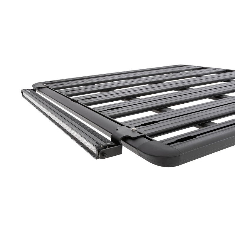 Black powder-coated steel LED light mounting bracket for Rhino-Rack Pioneer roof systems.