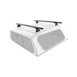 Four Rhino-Rack QMCM01 internal backing mounts with protective foam padding for canopy roof rack installation.