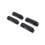 Set of four black Rhino-Rack Quick Mount leg bases and matching covers with included mounting hardware.