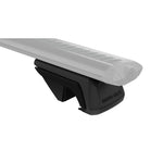 Set of four black Rhino-Rack RX100 raised leg mounts for vehicle roof rail systems.