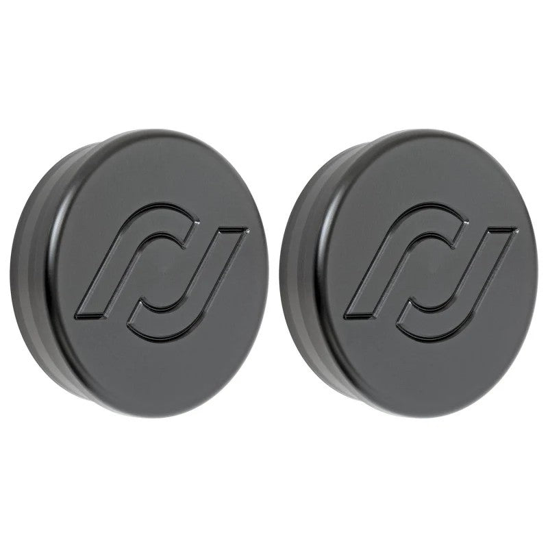 CNC machined black Delrin frame tube plugs for the front chassis crossmember of a Jeep Wrangler JL or Gladiator JT.
