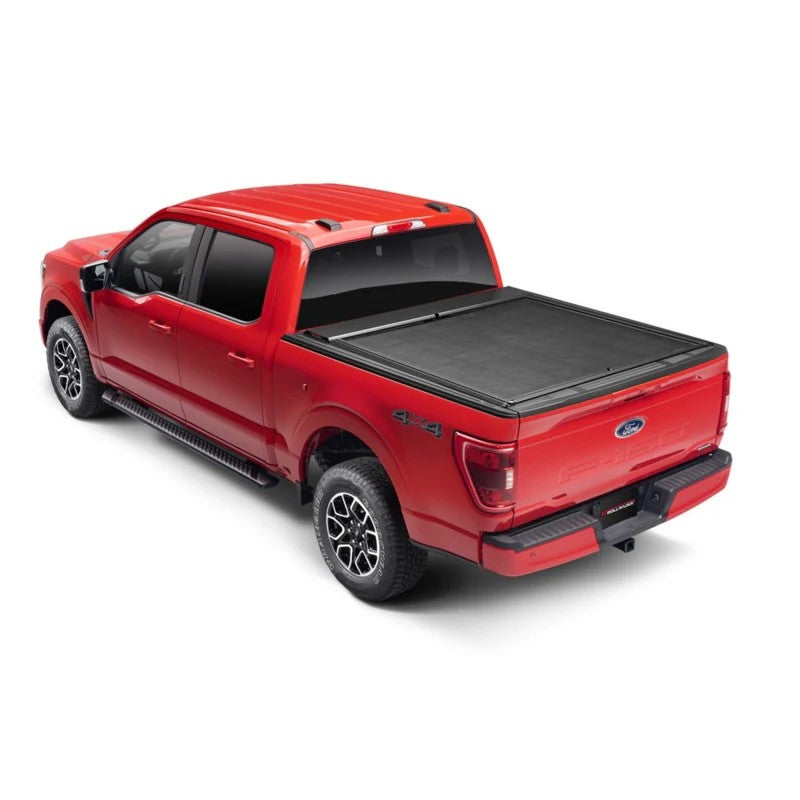 Roll-N-Lock M-Series XT retractable tonneau cover with T-slot rails on a Jeep Gladiator with a 60-inch bed.