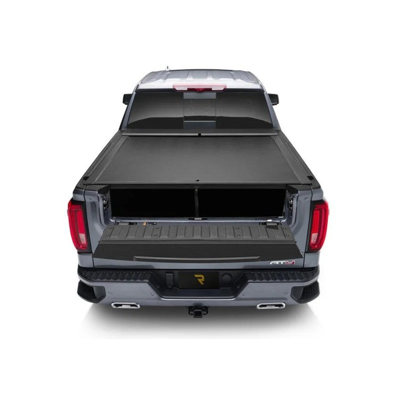 Roll-N-Lock M-Series retractable tonneau cover showing black vinyl-over-aluminum slats and compact storage housing.