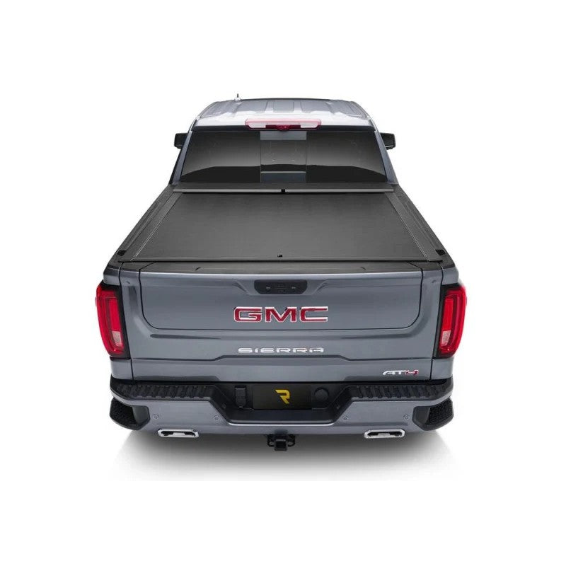 Roll-N-Lock M-Series retractable tonneau cover with black vinyl-over-aluminum slats and compact storage housing.