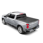 Roll-N-Lock E-Series electric retractable tonneau cover with powder-coated aluminum slats and compact storage canister.